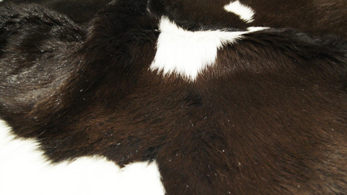 2' X 3' Brown And White Cowhide Abstract Hand Woven Area Rug
