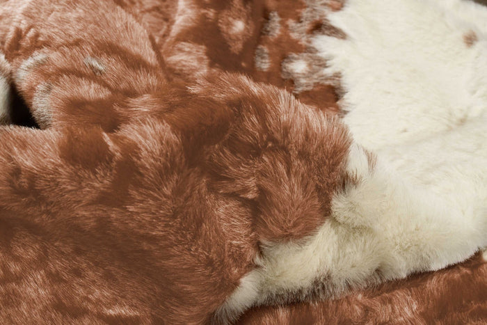 4' X 5' Brown And Ivory Faux Cowhide Animal Print Area Rug