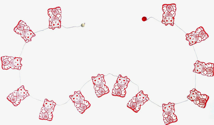 Handmade Lokta Paper Garland with Lucky Cat in red on a cream Lokta background.